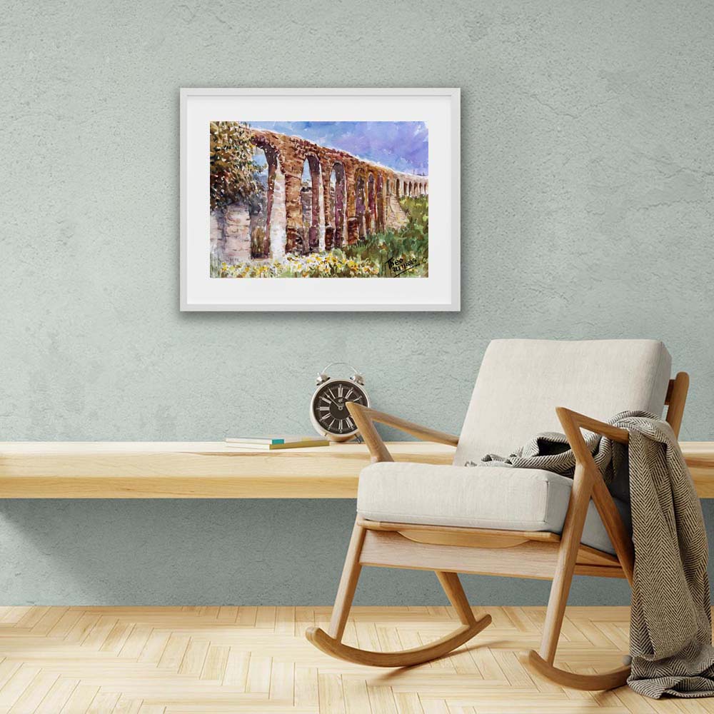 Framed painting of the Aqueduct Kamares in Larnaca by Theo Michael, an ancient stone aqueduct with greenery and typical spring flowers of Cyprus.