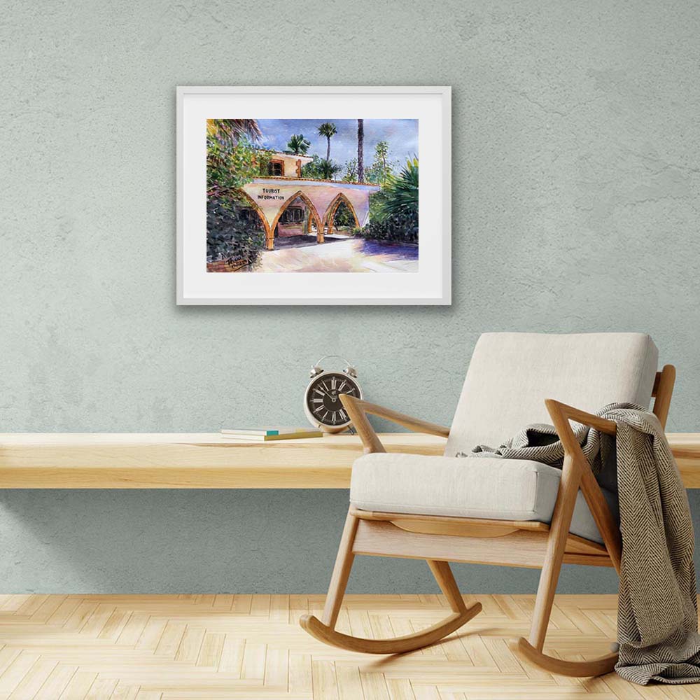 Watercolour painting of Larnaca's Tourist Information Board in a white frame. An original painting by Theo Michael featuring a historic building in Cyprus