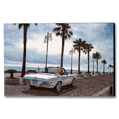 A rectangular canvas wall art print showing a beachside street scene with palm trees, vintage cars, and a blue sky, photographed against a plain white background.