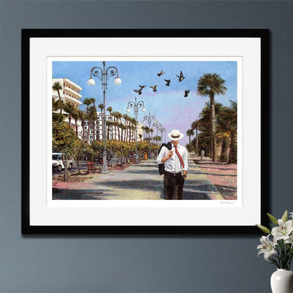 Hand Signed Fine Art print of a man walking down a palm tree-lined street with birds flying above, on the seafront promenade in Larnaca Cyprus. An oil painting by Theo Michael. 
