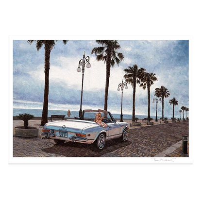 A square art print depicting a vintage convertible car parked on a seaside promenade lined with palm trees under a cloudy sky. The print is hand signed by Theo Michael.