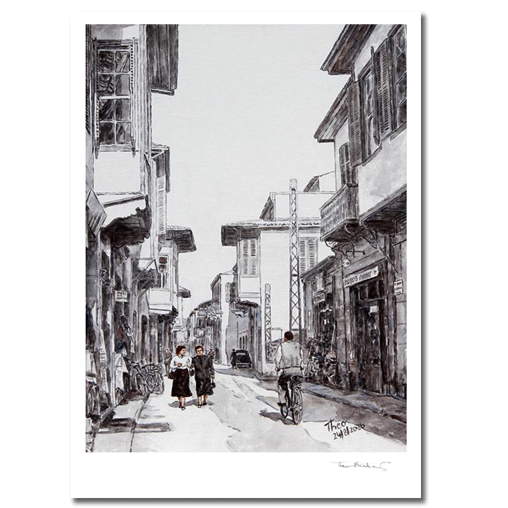 A black and white hand signed fine art print by Theo Michael, depicting Ledra street around the 1950s, featuring traditional buildings, pedestrians and a cyclist.