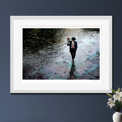 Fine Art Print Romance Isn't Dead painted by Theo Michael, best selling painting of a guy trodding through water in the rain with  bunch of roses in his hand. An art noir painting evoking strong emotions.