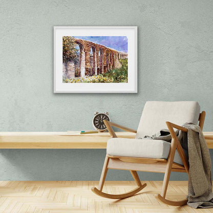 Framed painting of the Aqueduct Kamares in Larnaca by Theo Michael, an ancient stone aqueduct with greenery and typical spring flowers of Cyprus.